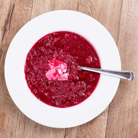 Vegetarian vegetable soup on a wooden tableの写真素材