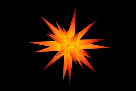 Christmass star isolated on a black backgroundの写真素材