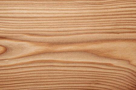 Wood texture with natural pattern. A fragment of a wooden panelの写真素材