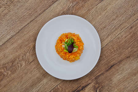 Lentil salad with Indian spice on a wooden table