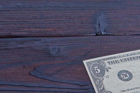 Dollar banknote on a wooden tableの写真素材