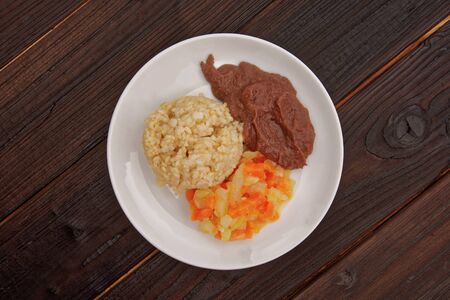 Azuki sauce with natural rice on a wooden tableの写真素材