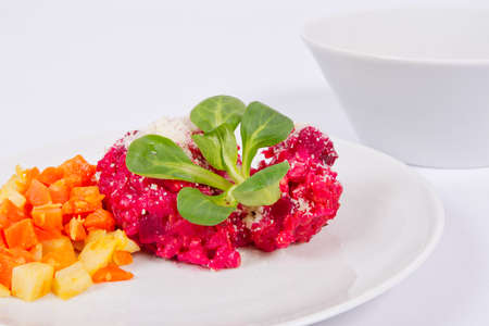 Risotto with red beet on a white backgroundの写真素材