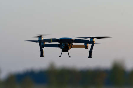 Drone quad copters with high resolution digital camera flying aerial over skyの写真素材