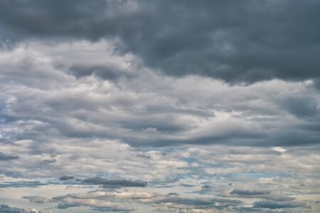 Overcast sky with dark clouds. The gray cloud, before rain