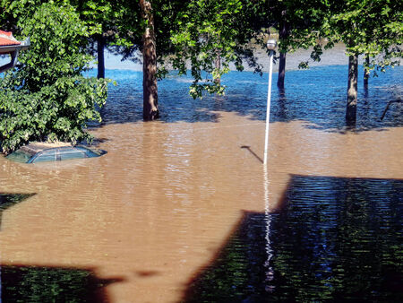 OBRENOVAC, SERBIA - MAY 23  House, car and street in Obrenovac under water  The water level of Sava River remains high in worst flooding on record across the Balkans on may 16, 2014    のeditorial素材