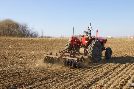 tractor in fieldの写真素材