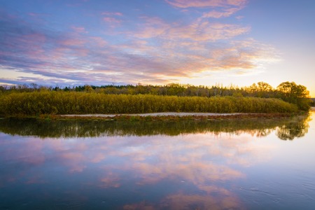 Colorfull autumn landscape with river at sunrise