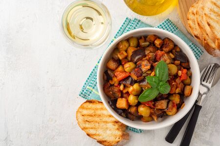 Traditional sicilian eggplant dish Caponata in bowl on concreteの写真素材