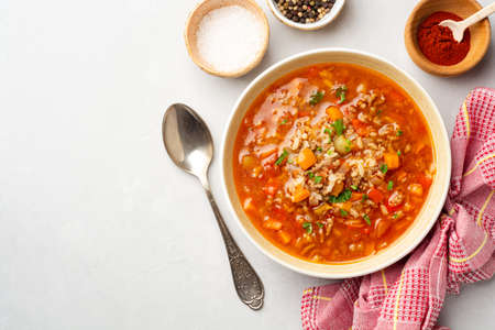 Stuffed pepper soup in bowl on concrete background. Top view, copy space.の写真素材