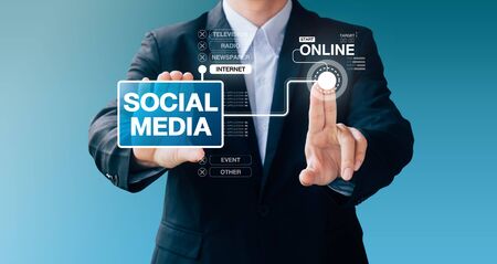 business man hand sign about use social media for advertising, Internet online conceptの写真素材