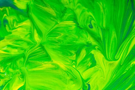 Colorful mix art paint background, green and yellowの写真素材