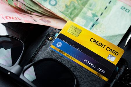 Close up credit card on black wallet backgroundの写真素材