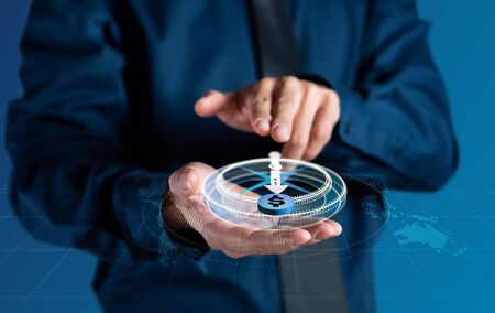 Businessman use digital 3d compass navigation for moneyの写真素材