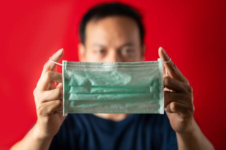 Man show mask for prevent virus infectの写真素材