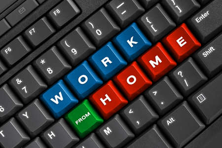 Work from home word on black keyboard, using computer online at home officeの写真素材