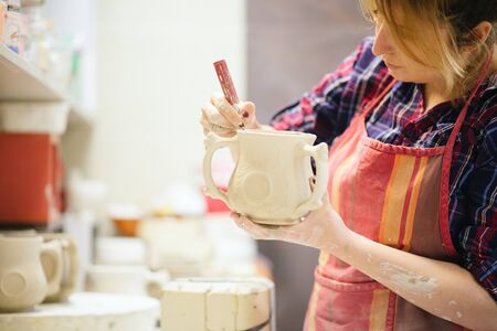 Pottery artist cutting edges