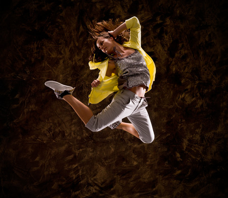 Modern hip-hop style teenage girl jumpingの写真素材