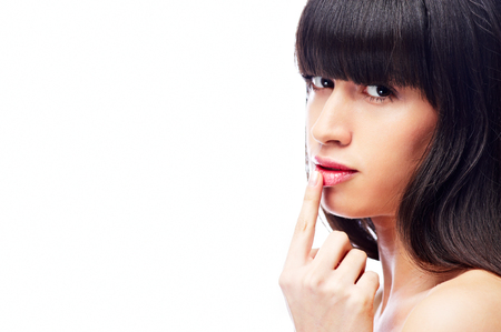 Woman with finger on lipsの写真素材