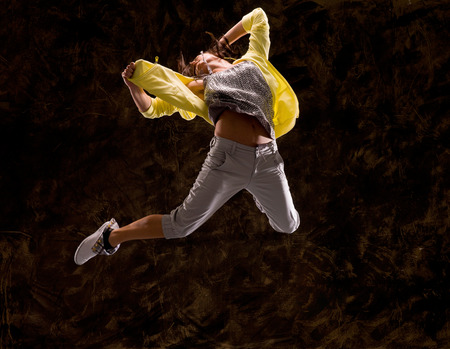 Modern hip-hop style teenage girl jumpingの写真素材