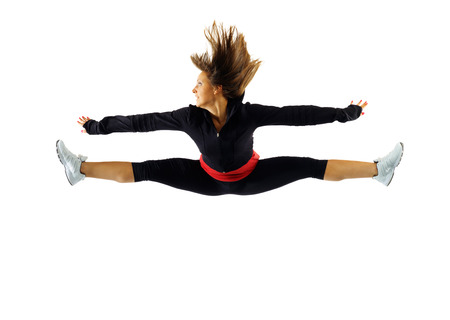 Girl in sport clothing in a jump
