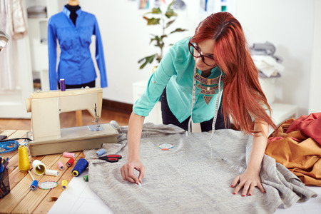 Designer drawing on textile materialの写真素材
