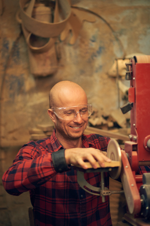 Carpenter using circular sanderの写真素材