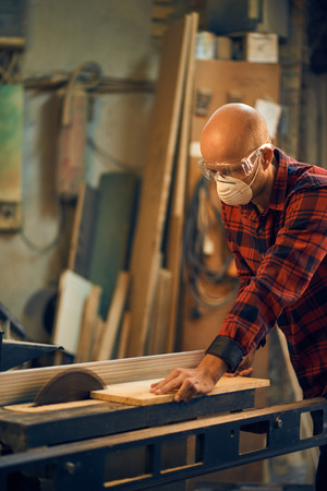 Carpenter at work at his workshopの写真素材
