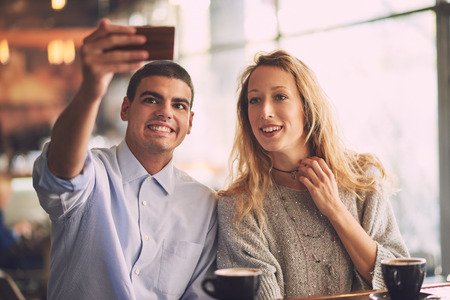 Making selfie in the cafeの写真素材