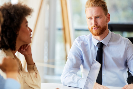 Startup concept - creative team talking in officeの写真素材