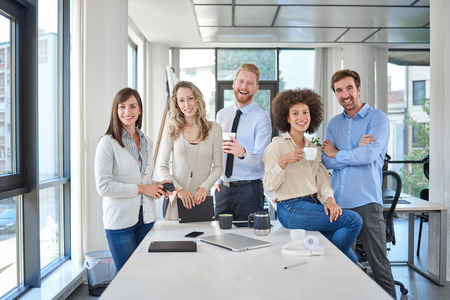 Group of multi ethnic business people posing in office. Start up business concept.の写真素材