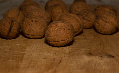 Walnuts on a wooden background.