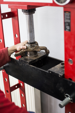 Worker fixing broken car partの写真素材