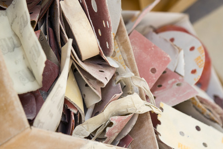 Box full of used sanding paperの写真素材