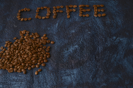 Coffee beans on dark blue background. Coffee conceptの写真素材