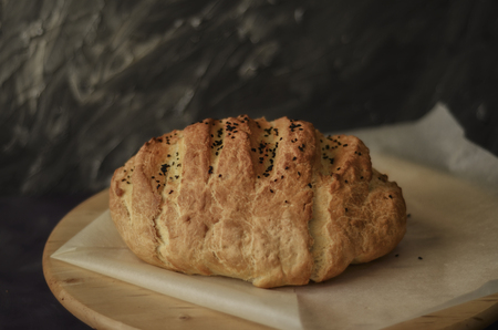 Loaf of bread on wooden table
