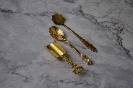 Gold spoon on marble table