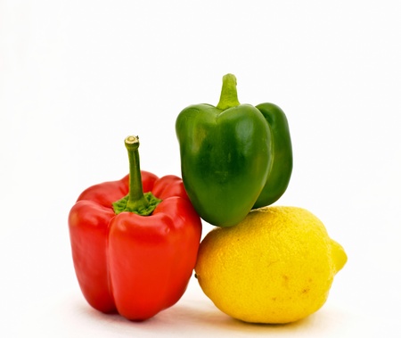 Three objects are two pepper and one lemonの写真素材