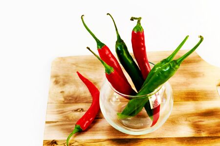 Pepper red and green in a glass vaseの写真素材