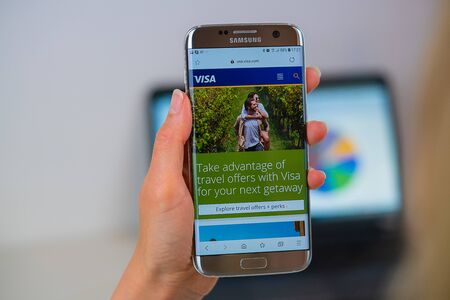 Barcelona / Spain 05 25 2019: Visa web site on mobile phone screen. Mobile version of Visa company web page on smartphone. Official web page of Visa.のeditorial素材