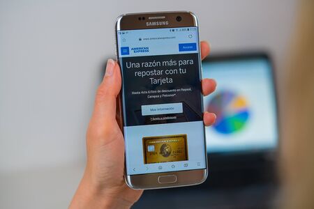Barcelona / Spain 05 25 2019: American Express web site on mobile phone screen. Mobile version of American Express company web page on smartphone. Official web page of American Express.のeditorial素材