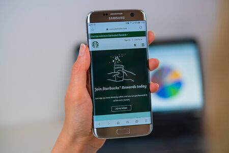 Barcelona / Spain 05 25 2019: Starbucks web site on mobile phone screen. Mobile version of Starbucks company web page on smartphone. Official web page of Starbucks.のeditorial素材