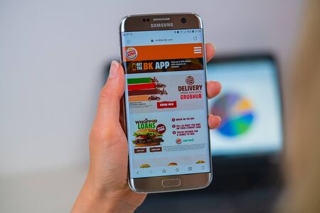 Barcelona / Spain 05 25 2019: Burger King web site on mobile phone screen. Mobile version of Burger King company web page on smartphone. Official web page of Burger King.のeditorial素材