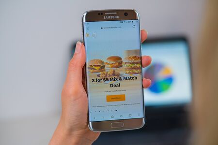Barcelona / Spain 05 25 2019: Mcdonalds web site on mobile phone screen. Mobile version of Mcdonalds company web page on smartphone. Official web page of Mcdonalds.のeditorial素材