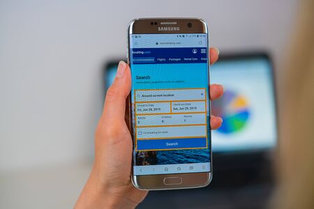 Barcelona / Spain 05 25 2019: Booking web site on mobile phone screen. Mobile version of Booking company web page on smartphone. Official web page of Booking.のeditorial素材