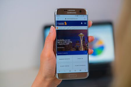 Barcelona / Spain 05 25 2019: Singapore airlines web site on mobile phone screen. Mobile version of Singapore airlines company web page on smartphone. Official web page of Singapore airlines.のeditorial素材