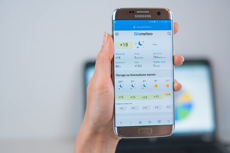 Barcelona / Spain 05 25 2019: Gismeteo web site on mobile phone screen. Mobile version of Gismeteo company web page on smartphone. Official web page of Gismeteoのeditorial素材