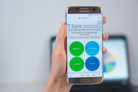 Barcelona / Spain 05 25 2019: TBank web site on mobile phone screen. Mobile version of TBank company web page on smartphone. Official web page of TBank.のeditorial素材