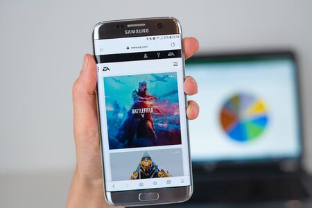 Barcelona / Spain 06 10 2019: EA games web site on mobile phone screen. Mobile version of EA company web page on smartphone. Official web page of EAのeditorial素材