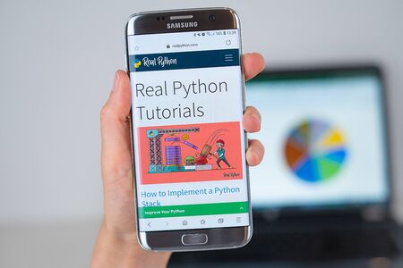 Barcelona / Spain 06 10 2019: Real Python web site on mobile phone screen. Mobile version of Real Python company web page on smartphone. Official web page of Real Python.のeditorial素材